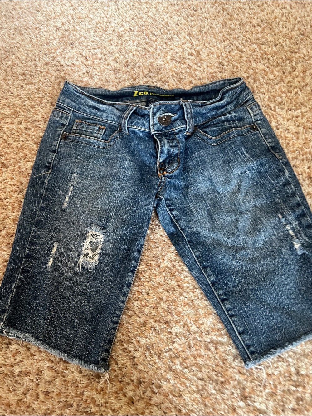 Junior’s Distressed Denim Bermuda Shorts - Blue - low rise